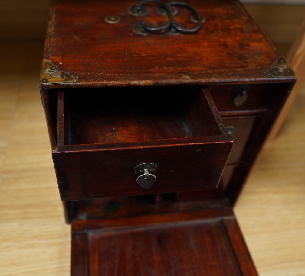 A 19th century Chinese elm scholar's seal cabinet with key, 31cm high. Condition - fair